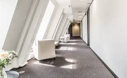 A corridor with high levels of natural light at the Birchin Court office space in Bank